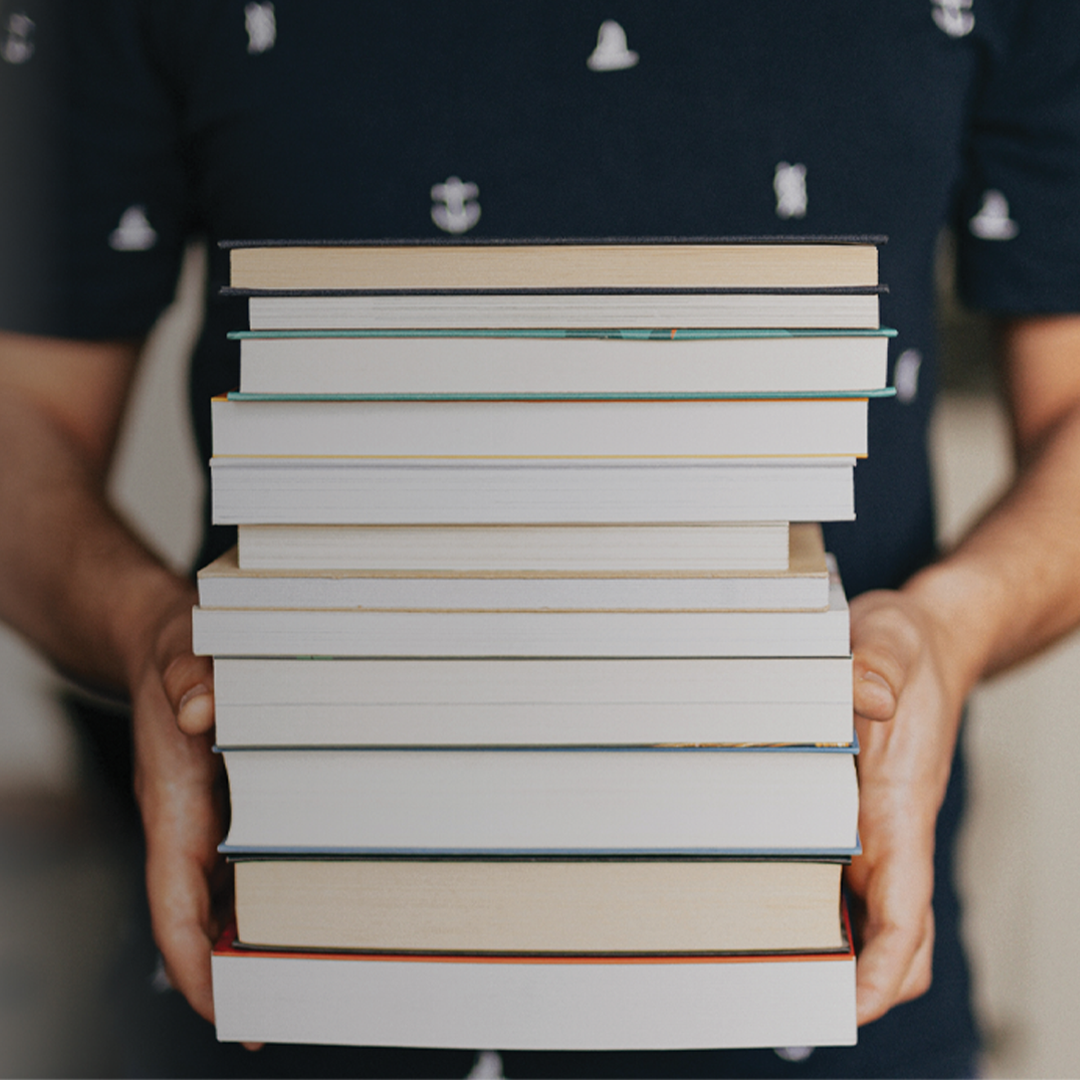 student holding books