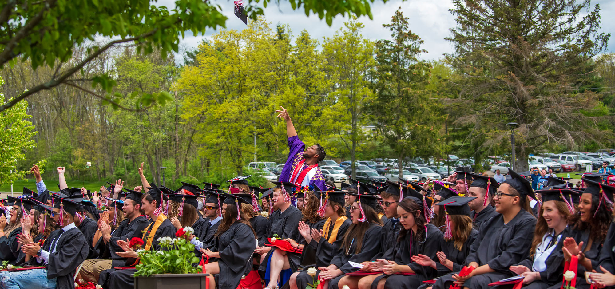 graduation cap being tossed in the air