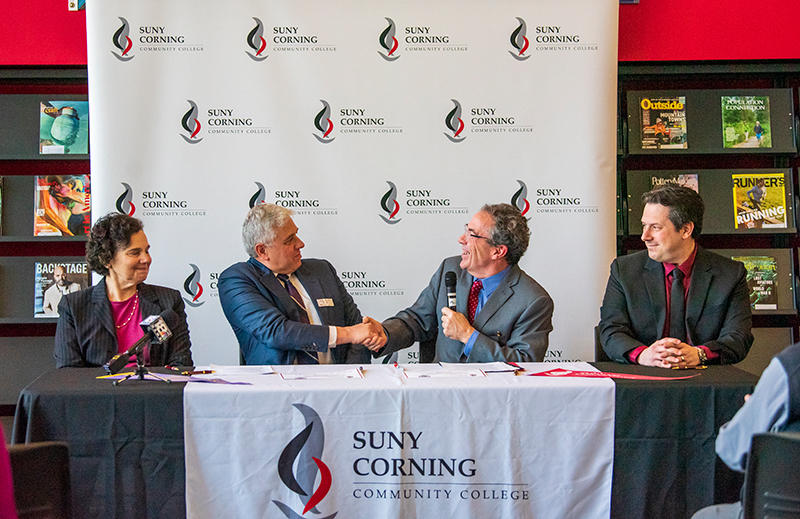 ccc articulation agreement signing, shaking hands