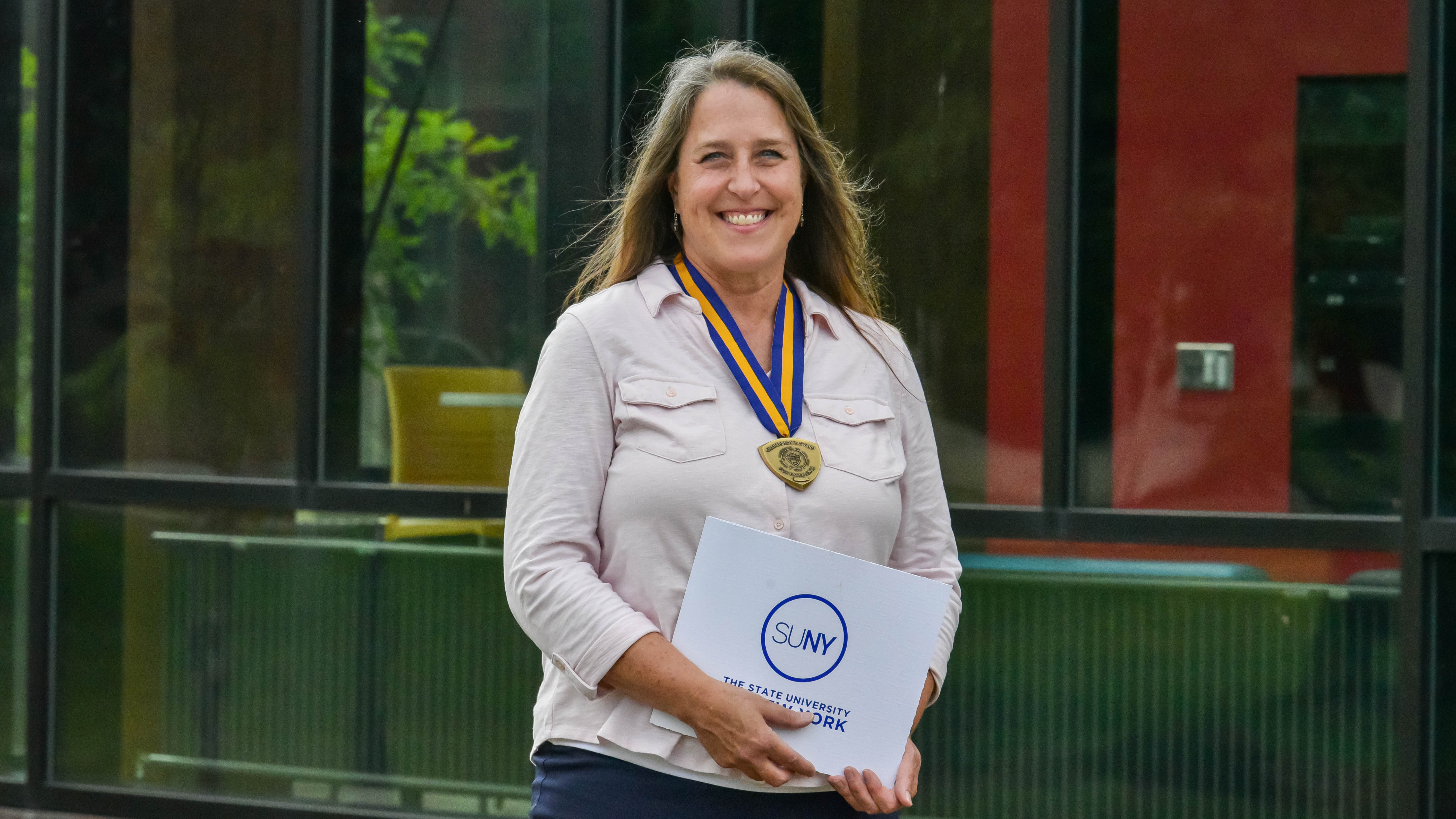 Kelly Beecher with SUNY Award